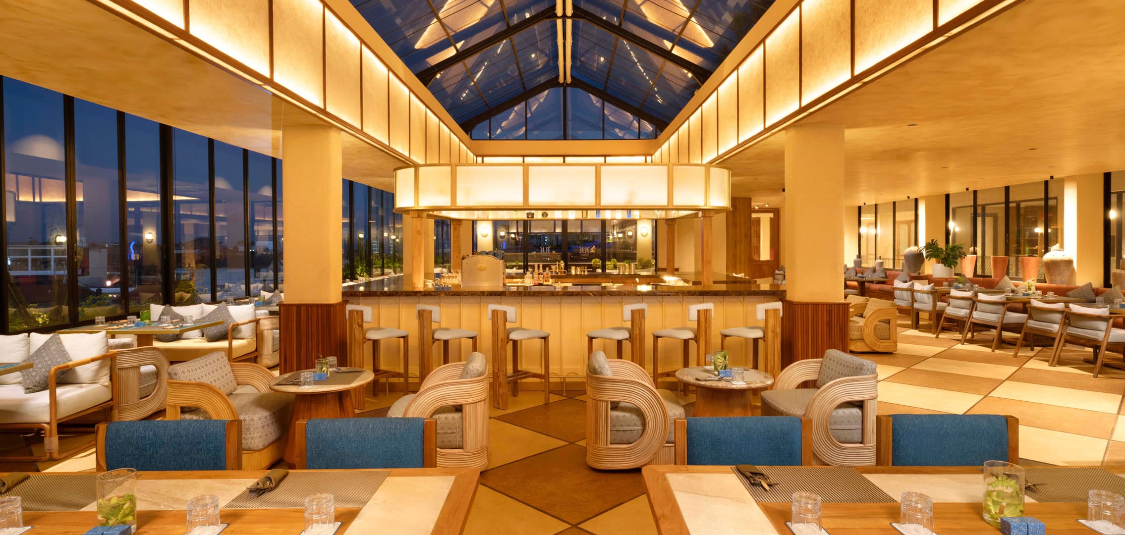 The Restaurant at TUI Blue Berawa · vaulted dining hall at blue hour